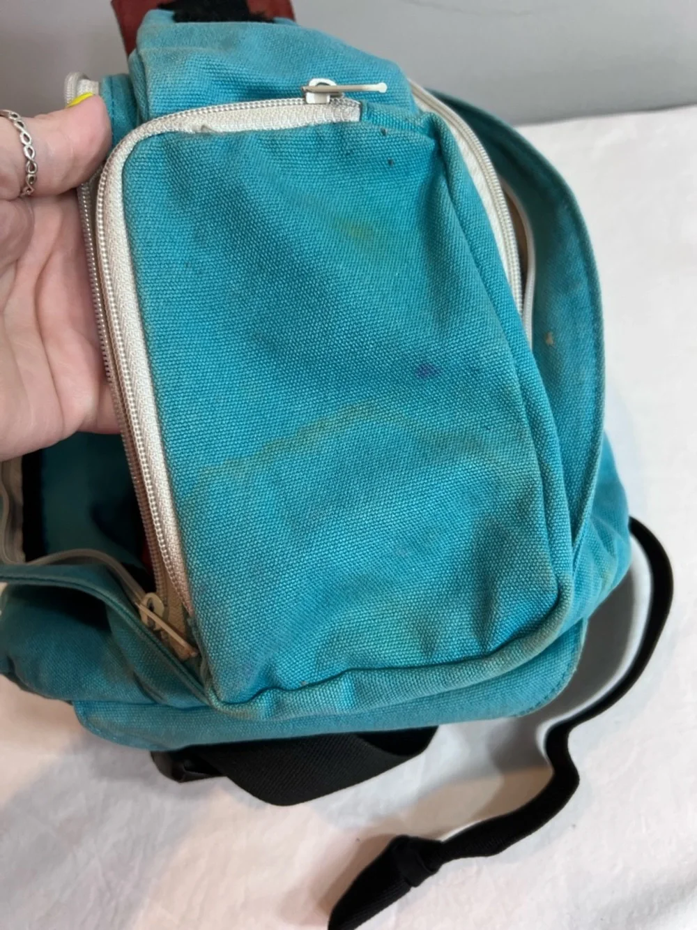 Kavu teal rope sling bag backpack